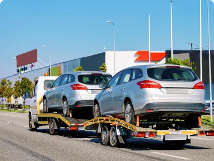car-carrying-trailer-with-new-vehicles-asphalt-road-slovenia 1